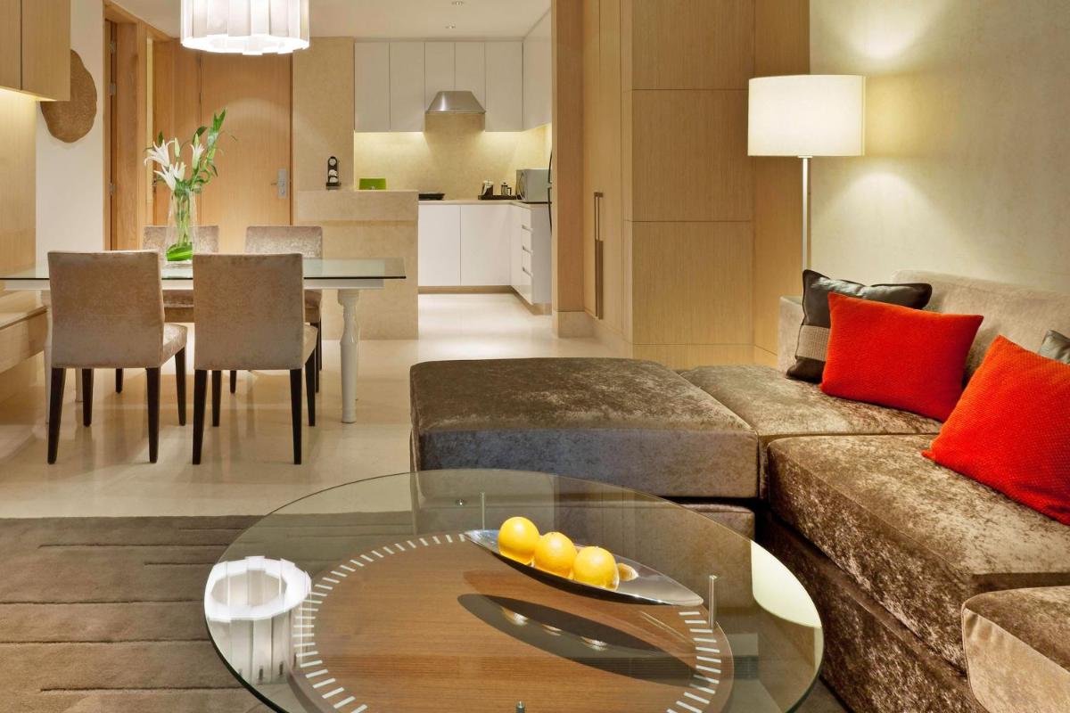a living room with a couch and a table at The Westin Gurgaon, New Delhi in Gurgaon