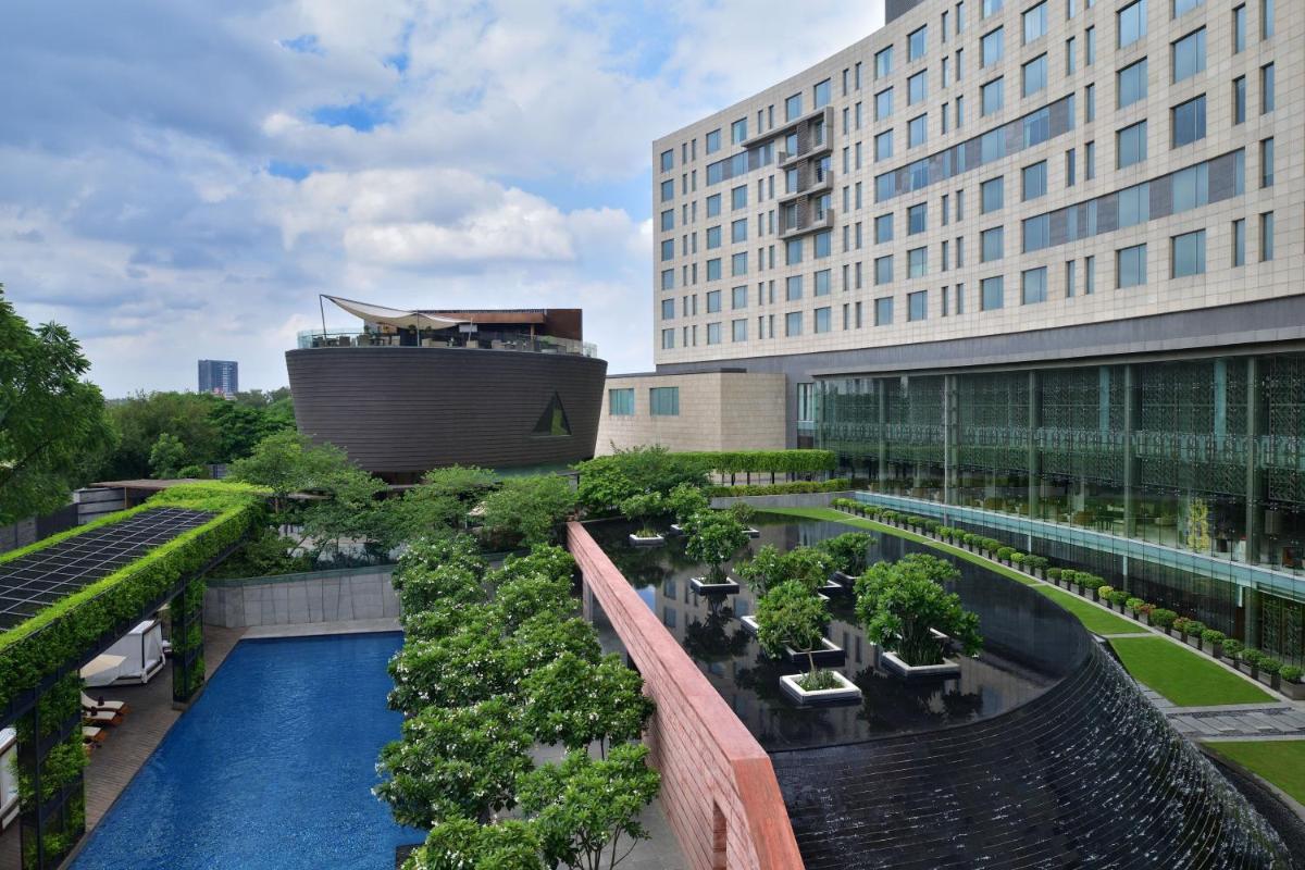 arial view of a building with a pool and trees at The Westin Gurgaon, New Delhi in Gurgaon