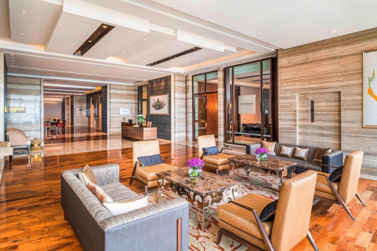 a living room with couches and tables at The St. Regis Mumbai in Mumbai