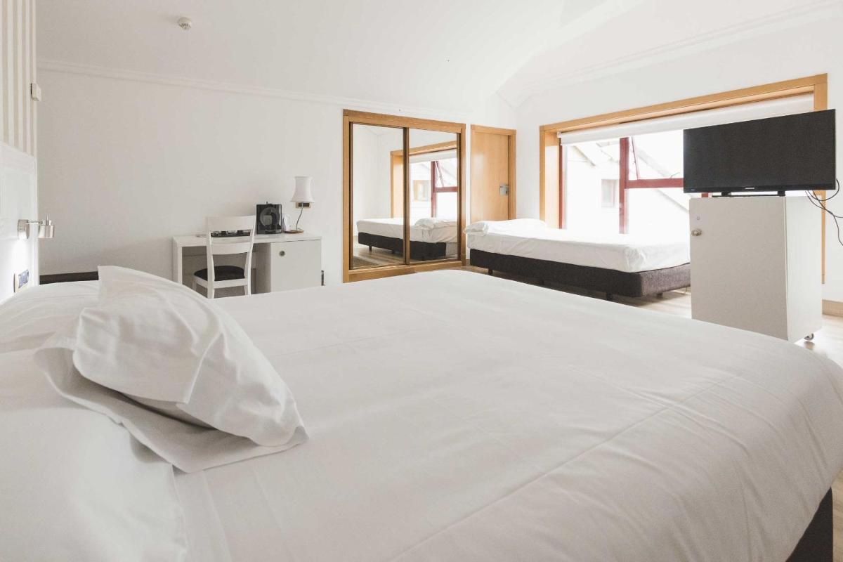 Cama o camas de una habitación en Hotel Alfonso I