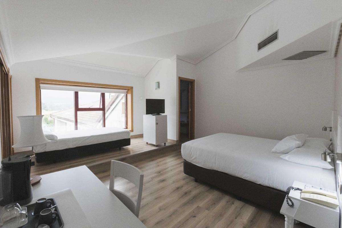 Cama o camas de una habitación en Hotel Alfonso I