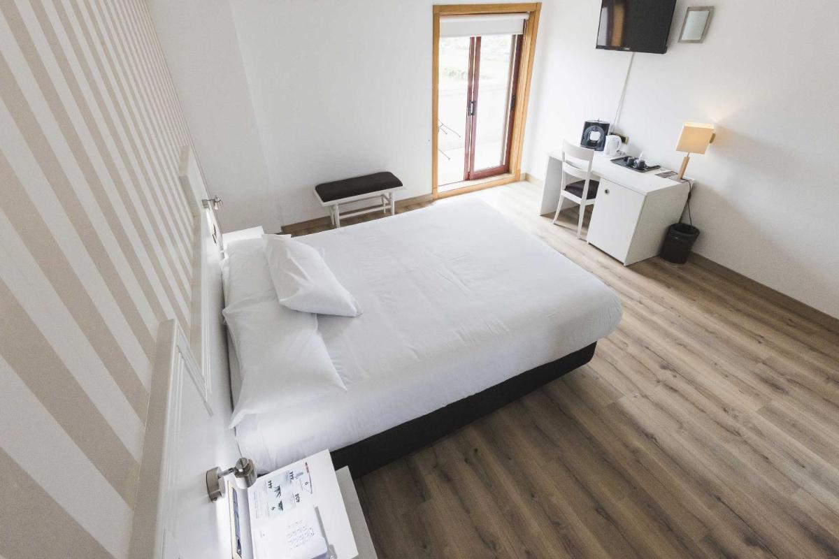 Cama o camas de una habitación en Hotel Alfonso I