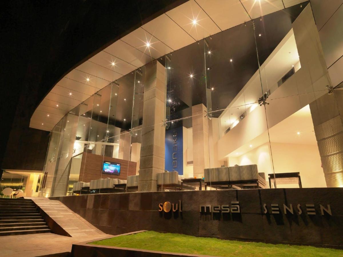 a large glass building with a stage in front of it at Svenska Design Hotel, Electronic City, Bangalore in Bengaluru a large glass building with a stage in front of it at Svenska Design Hotel, Electronic City, Bangalore in Bengaluru