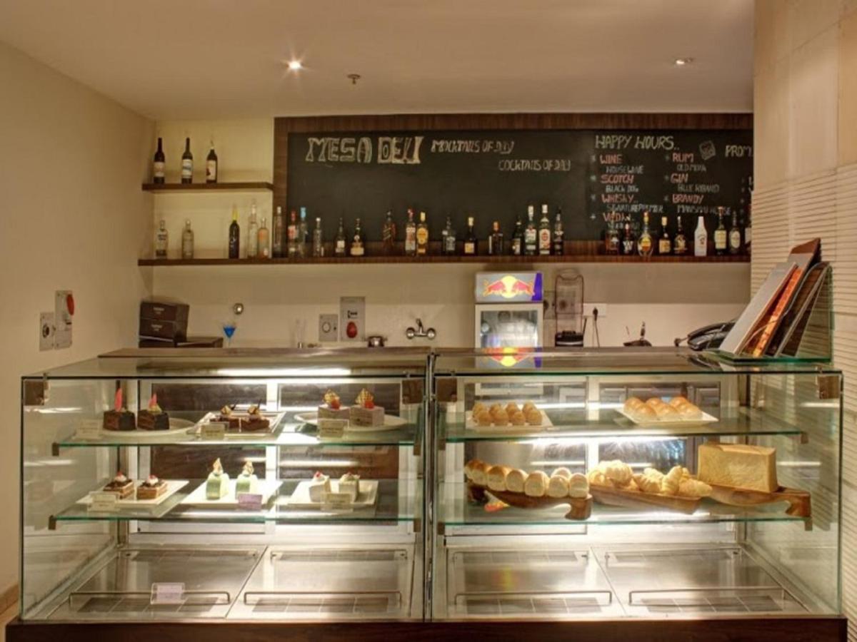 a display case in a bakery with various pastries at Svenska Design Hotel, Electronic City, Bangalore in Bengaluru a display case in a bakery with various pastries at Svenska Design Hotel, Electronic City, Bangalore in Bengaluru