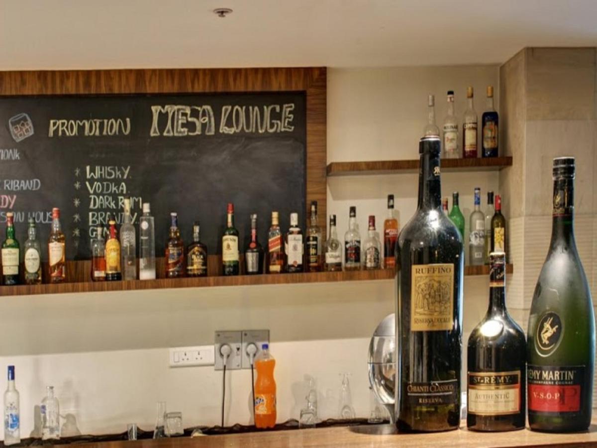 a bunch of bottles of alcohol on a bar at Svenska Design Hotel, Electronic City, Bangalore in Bengaluru a bunch of bottles of alcohol on a bar at Svenska Design Hotel, Electronic City, Bangalore in Bengaluru