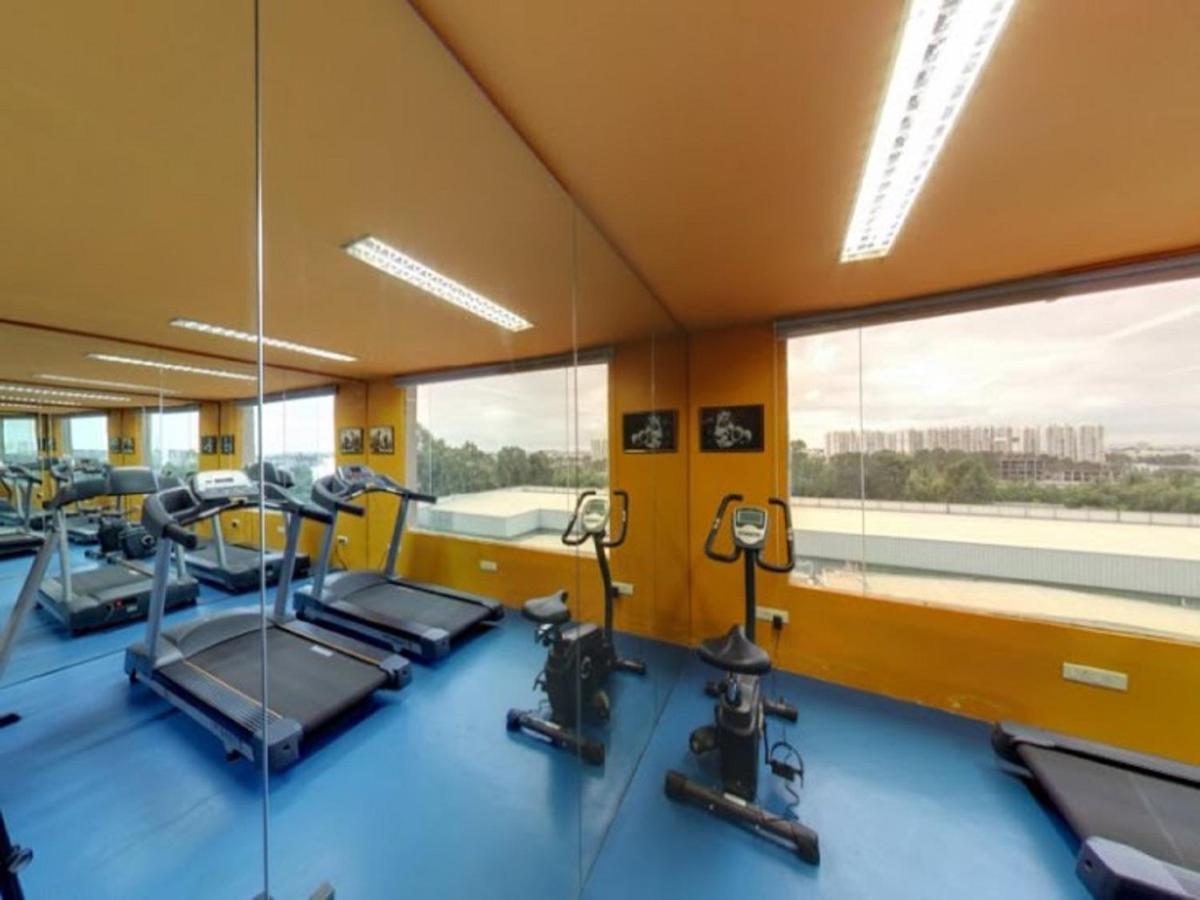 a gym with treadmills and ellipticals and windows at Svenska Design Hotel, Electronic City, Bangalore in Bengaluru a gym with treadmills and ellipticals and windows at Svenska Design Hotel, Electronic City, Bangalore in Bengaluru