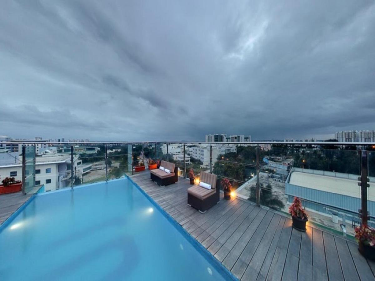 a large swimming pool on the roof of a building at Svenska Design Hotel, Electronic City, Bangalore in Bengaluru a large swimming pool on the roof of a building at Svenska Design Hotel, Electronic City, Bangalore in Bengaluru