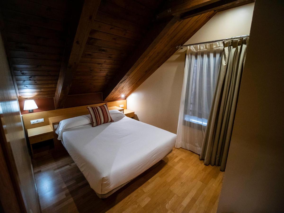Cama o camas de una habitación en Aparthotel Siente Boí & SPA