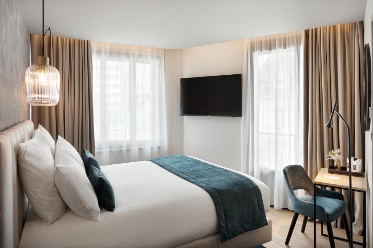 Un ou plusieurs lits dans un hébergement de l'établissement Hôtel & Spa Le Maury, Vannes, The Originals Boutique