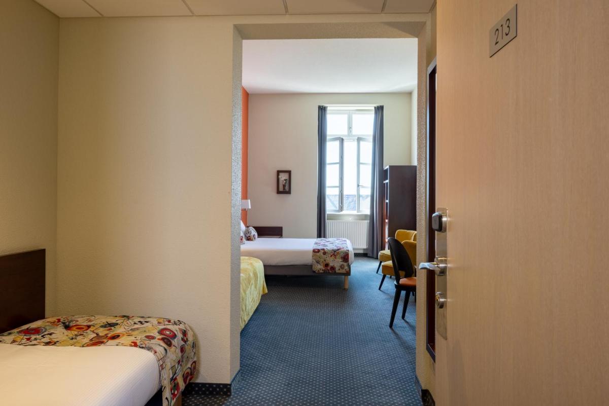Un ou plusieurs lits dans un hébergement de l'établissement Hôtel Val-Vignes Colmar Haut-Koenigsbourg, The Originals Relais