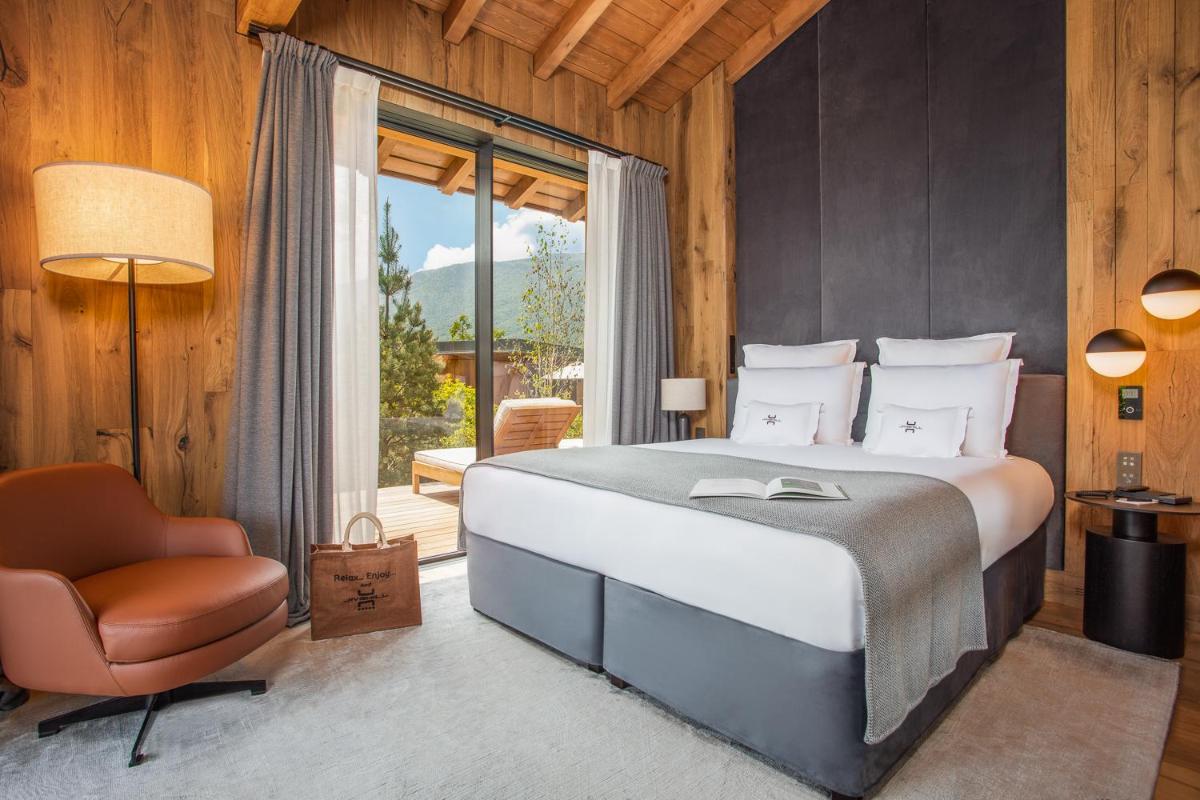 Un ou plusieurs lits dans un hébergement de l'établissement Jiva Hill Resort - Genève