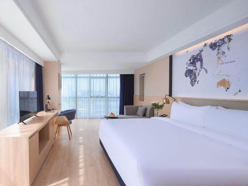 Kyriad Marvelous Hotel Suzhou Wujiang People Square - Housity