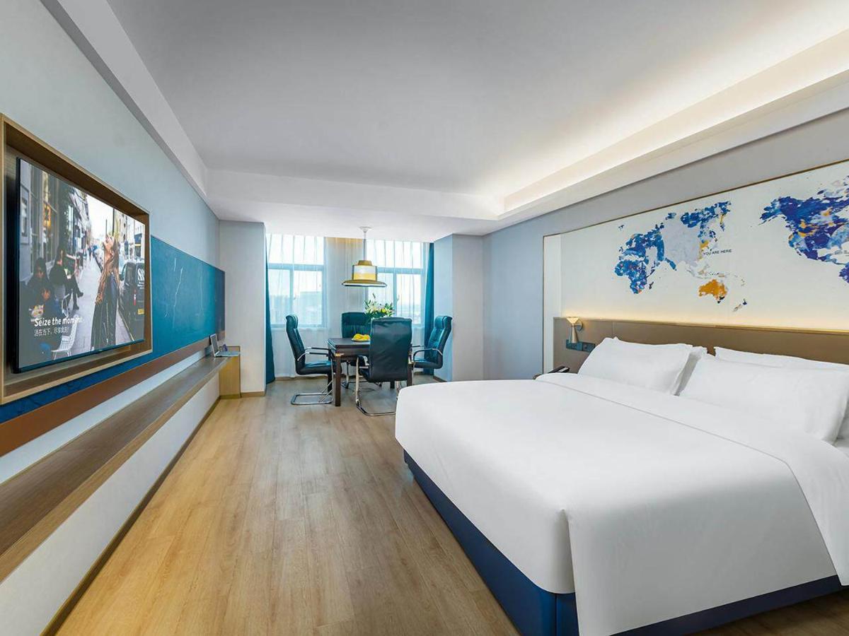 Kyriad Hotel Jiujiang Happy City - Housity