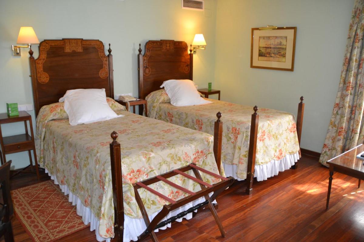 Cama o camas de una habitación en Hotel Las Casas de la Judería