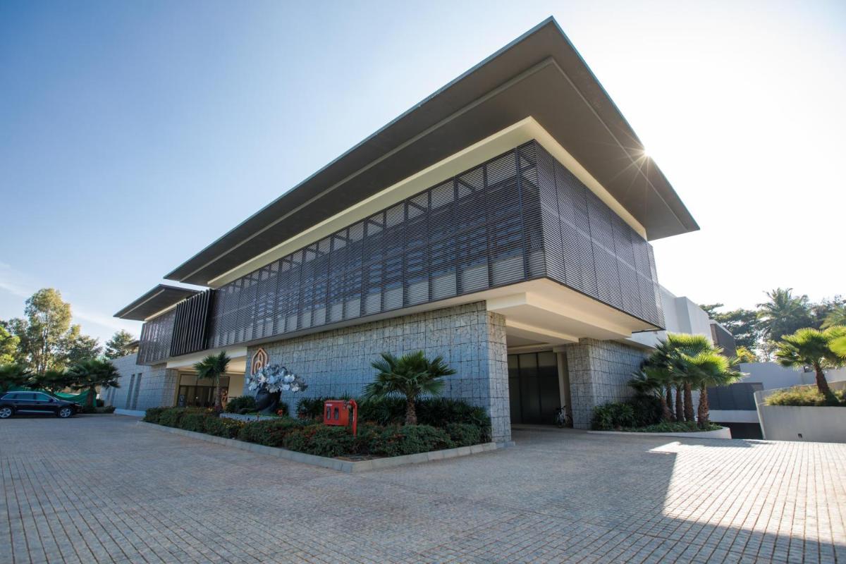a large building with a lot of windows at BLVD Club - Near BENGALURU AIRPORT in Bengaluru