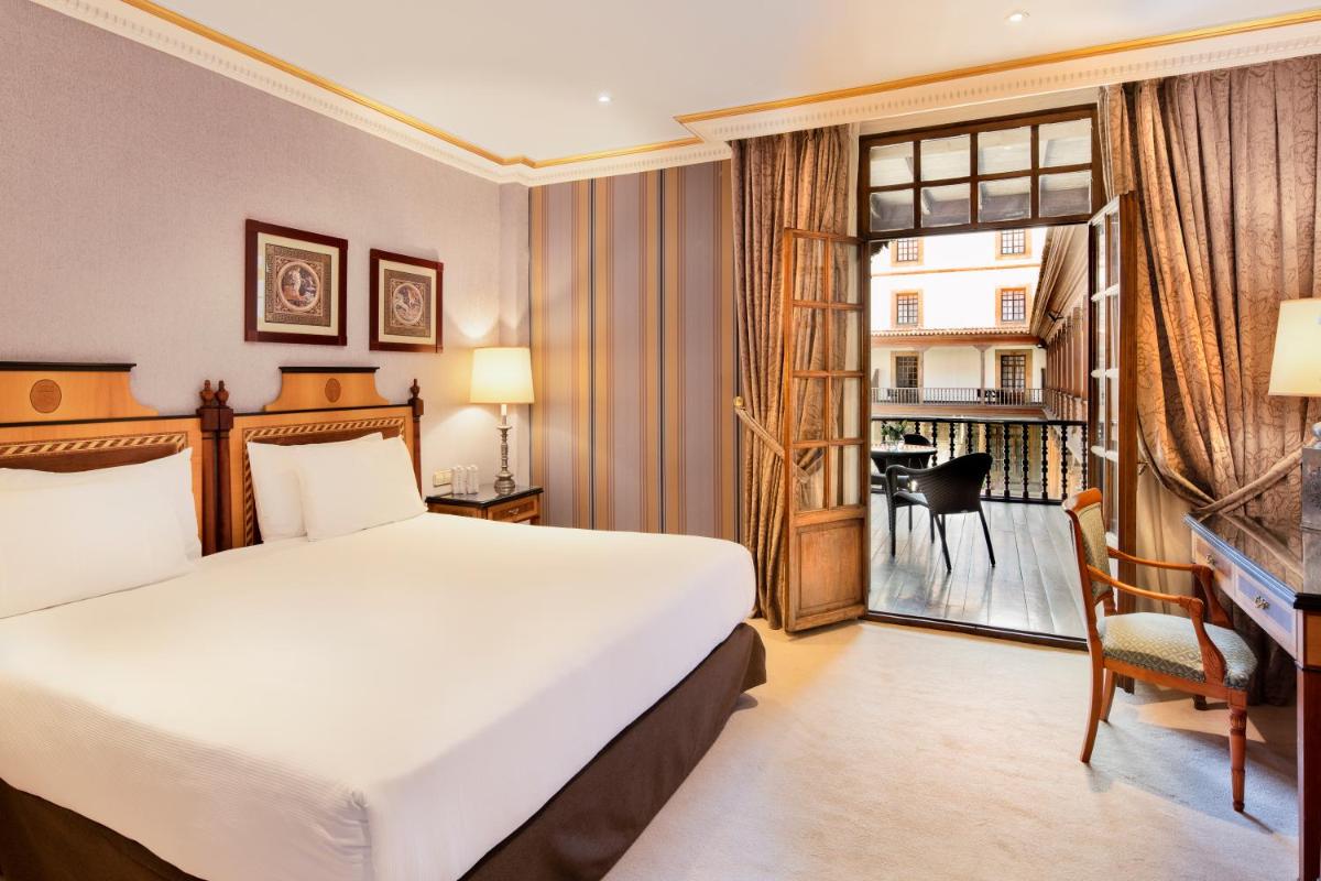 Cama o camas de una habitación en Eurostars Hotel de la Reconquista