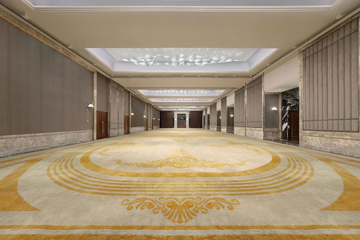 a large room with a large rug on the floor at The Westin Pune Koregaon Park in Pune