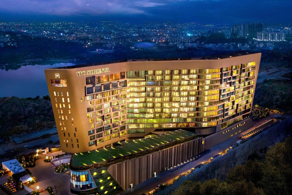 a hotel building with lights on at night at ITC Kohenur, a Luxury Collection Hotel, Hyderabad in Hyderabad
