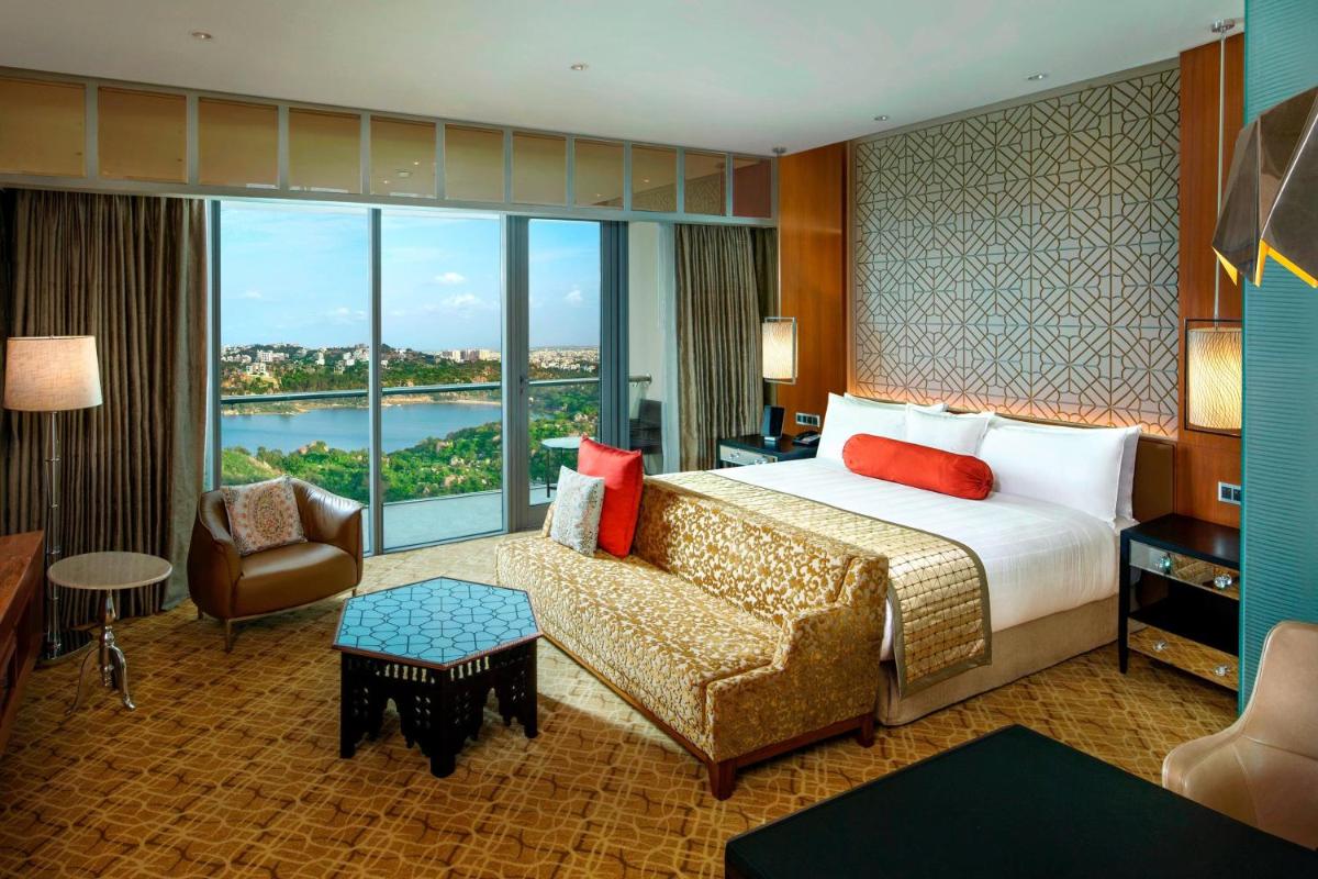 a hotel room with a bed and a couch at ITC Kohenur, a Luxury Collection Hotel, Hyderabad in Hyderabad