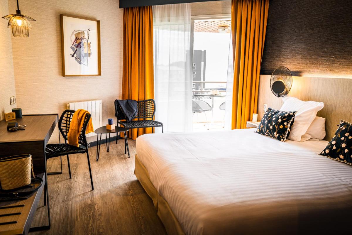 Un ou plusieurs lits dans un hébergement de l'établissement Hôtel Valdys Thalasso & Spa - les Pins