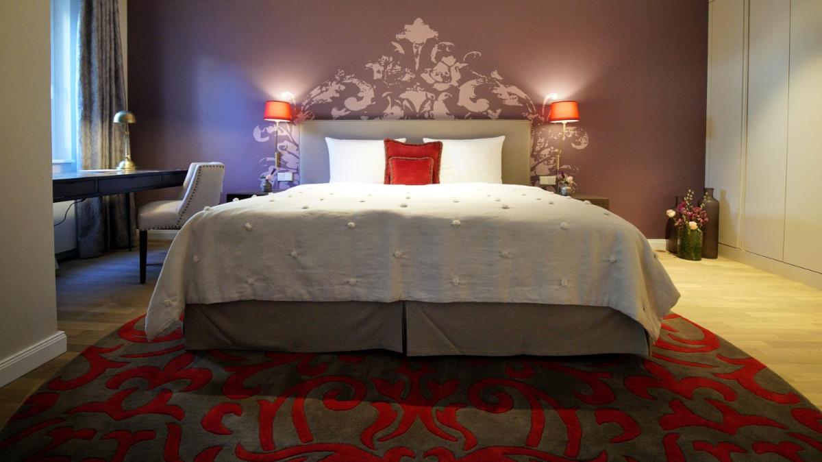 Ein Bett oder Betten in einem Zimmer der Unterkunft VILA VITA Rosenpark Ein Bett oder Betten in einem Zimmer der Unterkunft VILA VITA Rosenpark