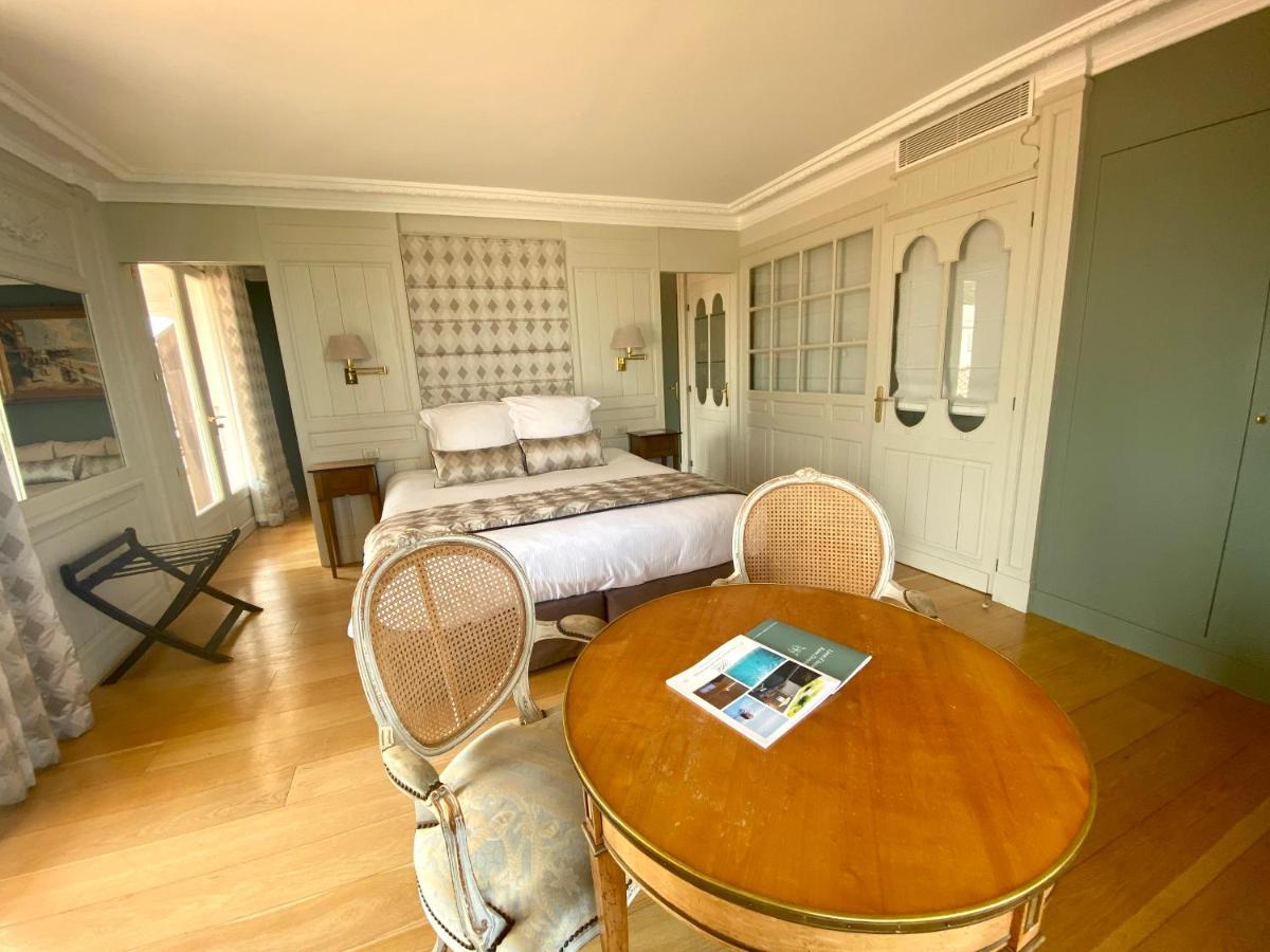 Un ou plusieurs lits dans un hébergement de l'établissement HR Hôtel-Restaurant & Spa Marin