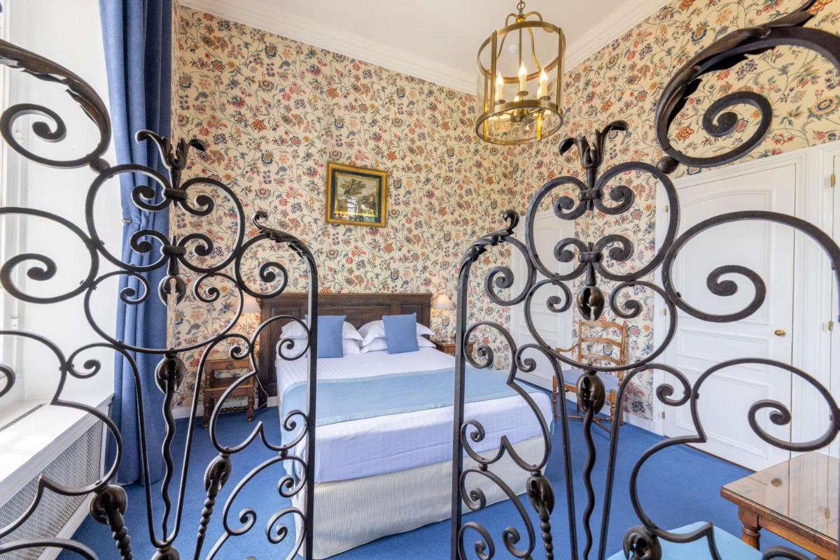 Un ou plusieurs lits dans un hébergement de l'établissement Château D'artigny
