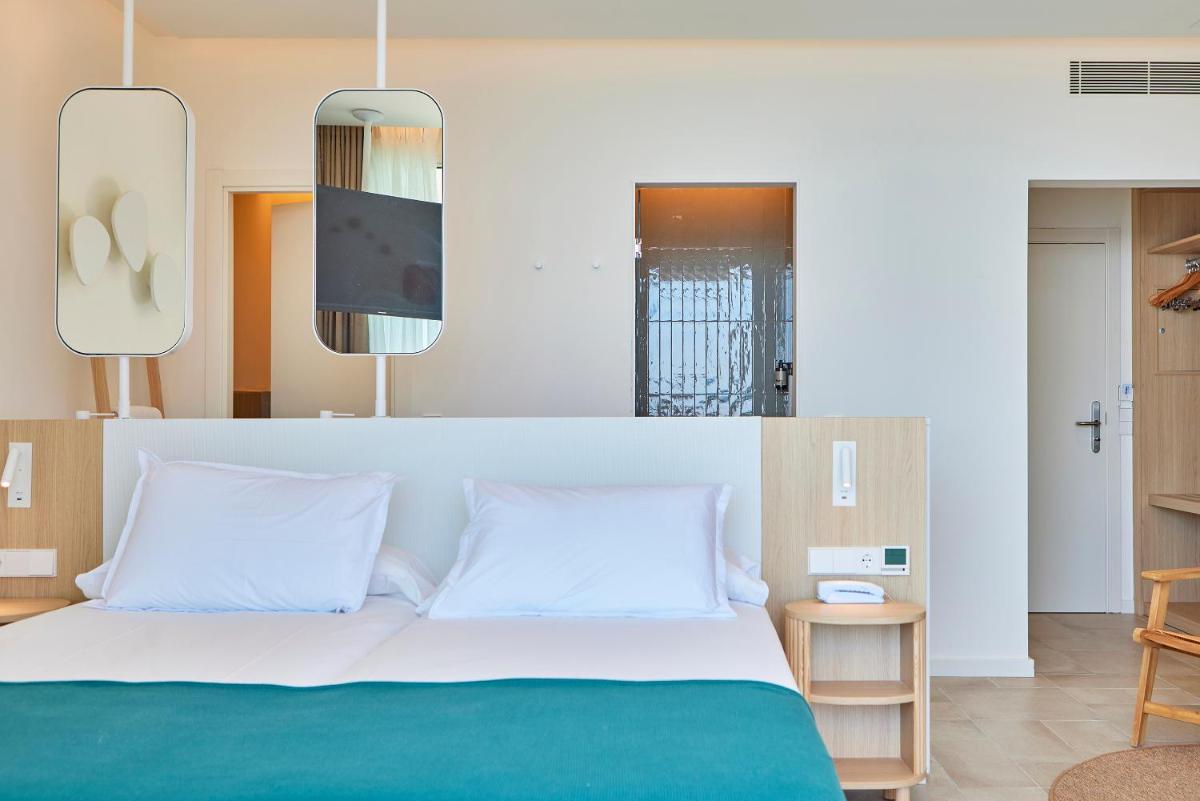 Cama o camas de una habitación en Universal Hotel Aquamarin