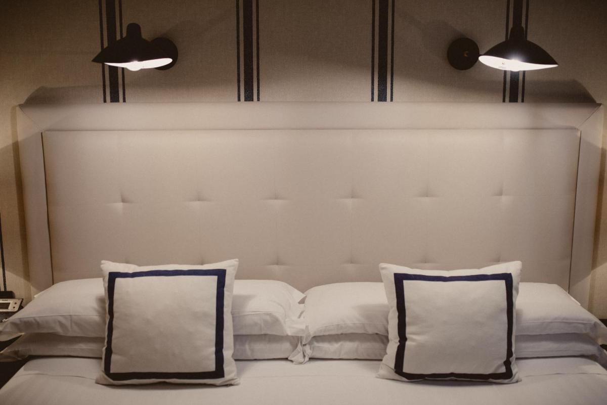 Cama o camas de una habitación en Hotel Mercure Jardines de Albia
