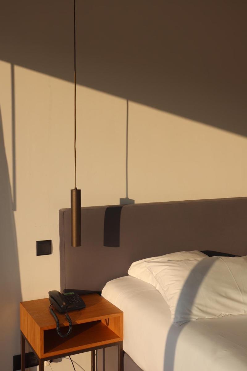 Uma cama ou camas num quarto em Monte Prado Hotel & Spa