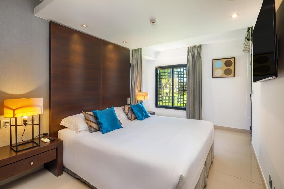 Uma cama ou camas num quarto em AP Adriana Beach Resort