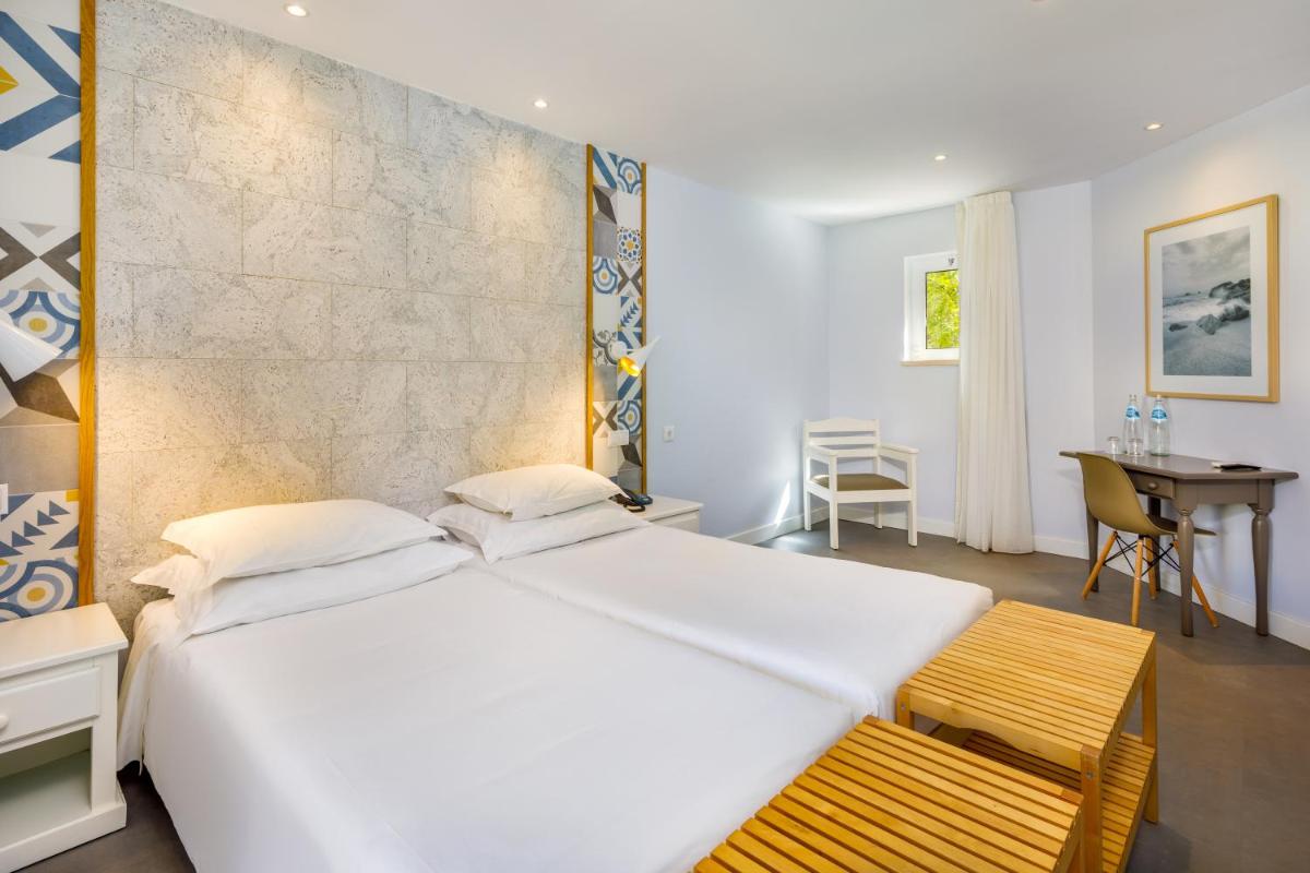Uma cama ou camas num quarto em AP Adriana Beach Resort