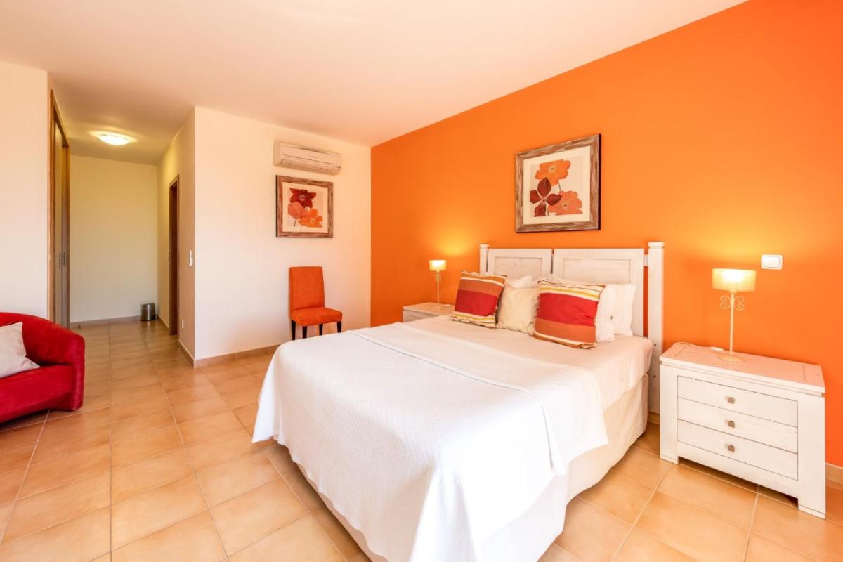 Uma cama ou camas num quarto em Estrela da Luz Resort