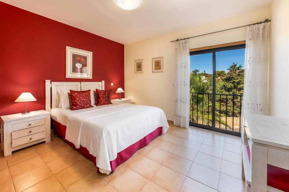 Uma cama ou camas num quarto em Estrela da Luz Resort