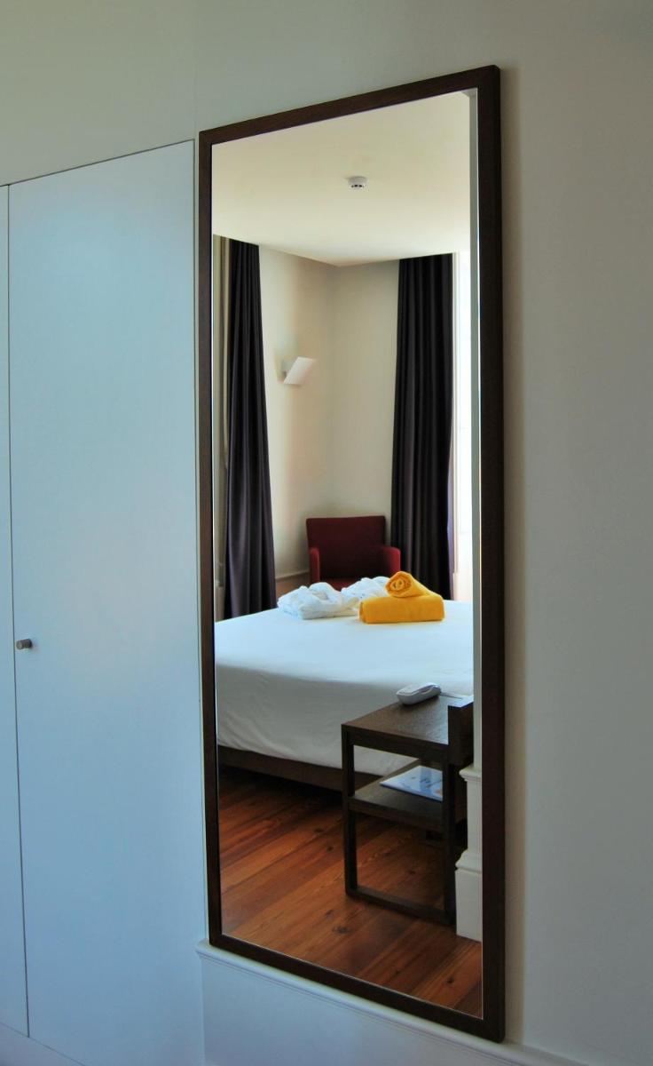 Uma cama ou camas num quarto em Hotel Quinta da Cruz & SPA