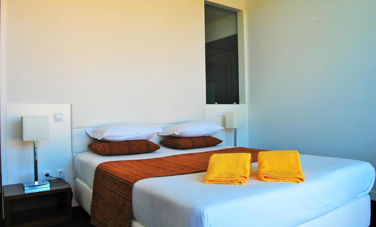 Uma cama ou camas num quarto em Hotel Quinta da Cruz & SPA