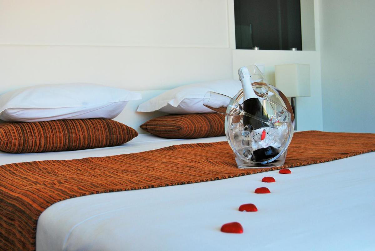Uma cama ou camas num quarto em Hotel Quinta da Cruz & SPA