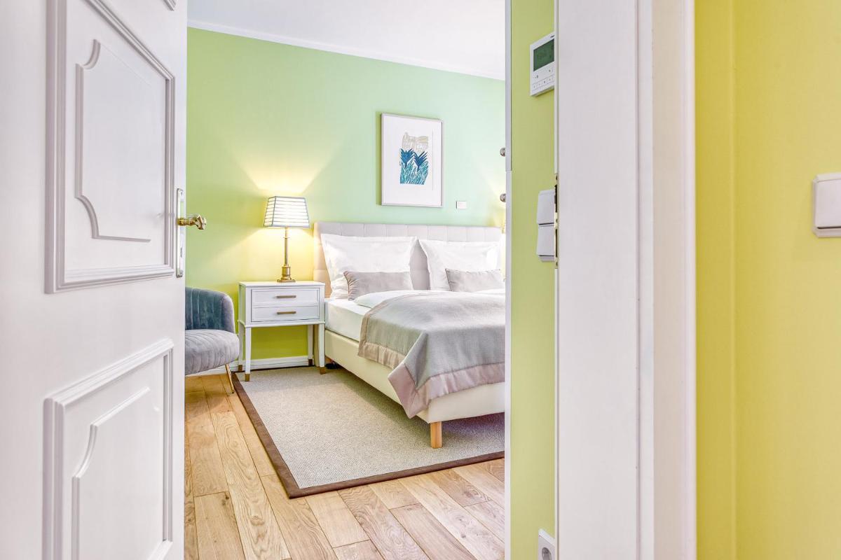 Ein Bett oder Betten in einem Zimmer der Unterkunft Wald & Schlosshotel Friedrichsruhe