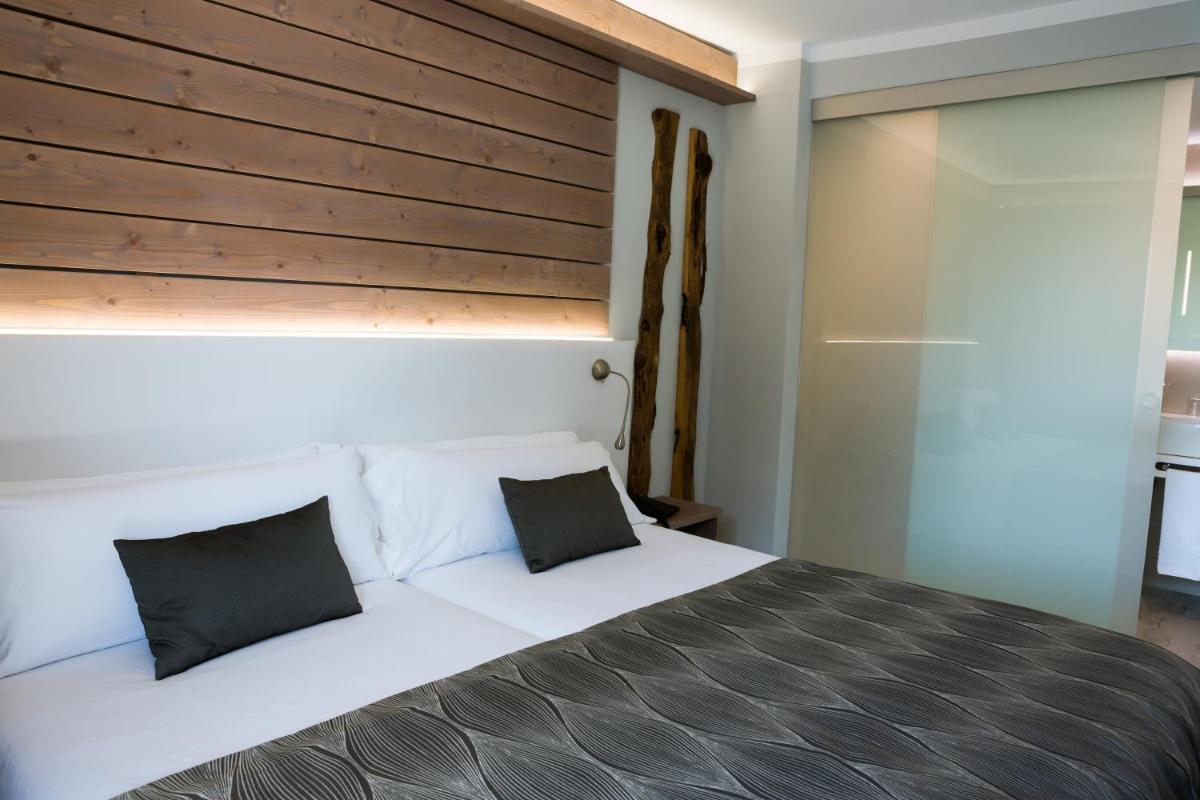 Cama o camas de una habitación en Hotel Bahia del Sol