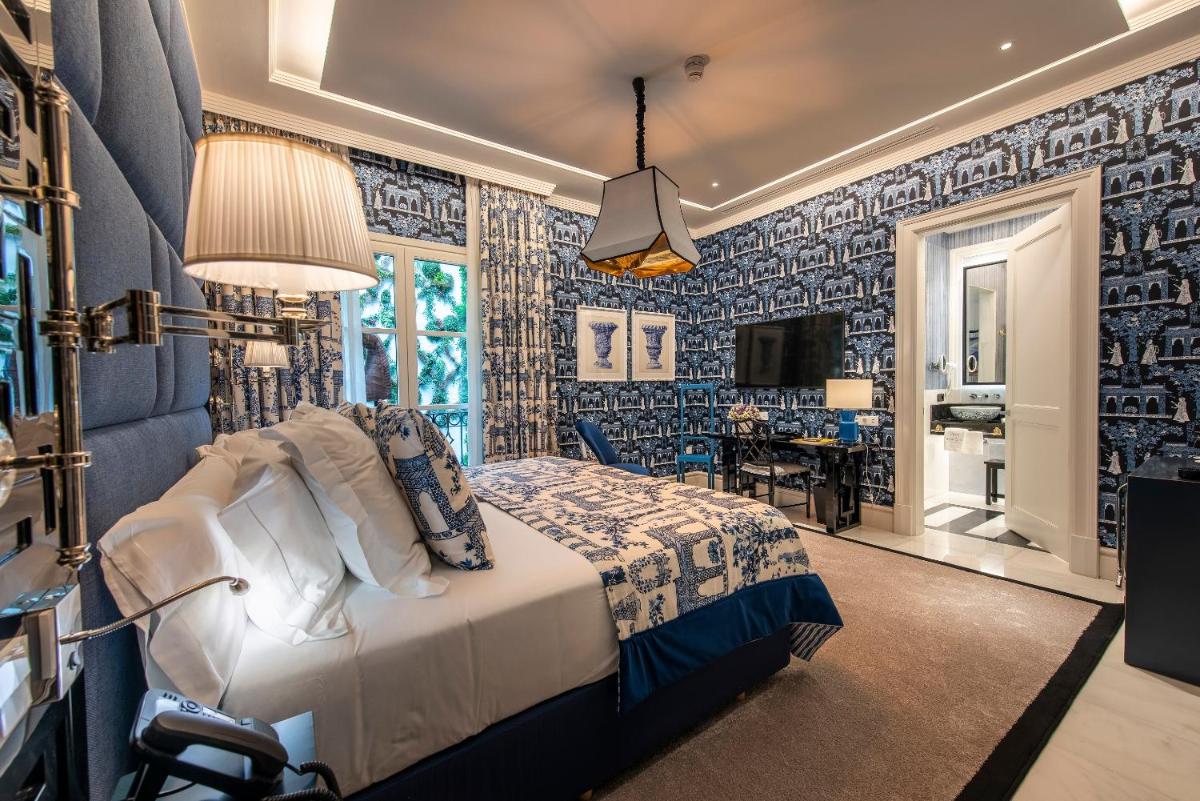 Cama o camas de una habitación en Hotel Casa Palacio María Luisa