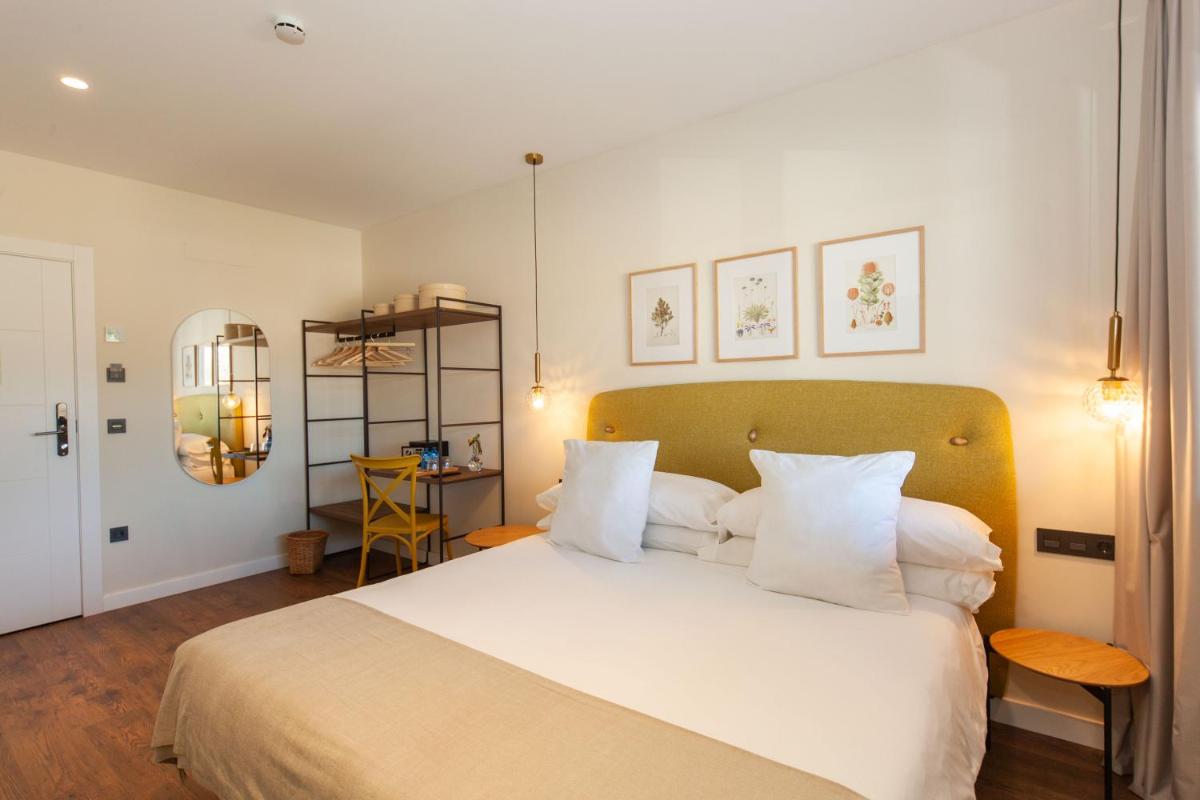 Cama o camas de una habitación en Duruelo Mountain Suites