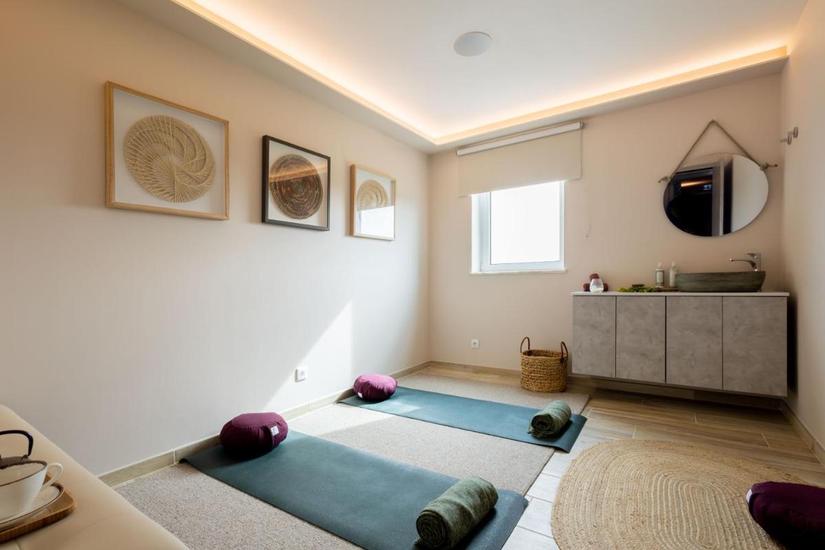 Uma cama ou camas num quarto em Sleep & Nature Hotel