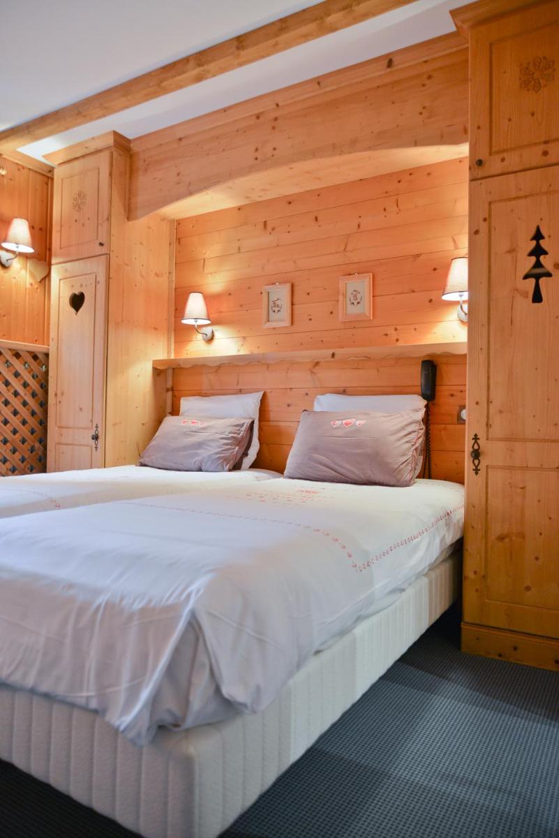 Un ou plusieurs lits dans un hébergement de l'établissement Café-Hôtel Le Morillon, Domaine du Grand Massif-Samoëns