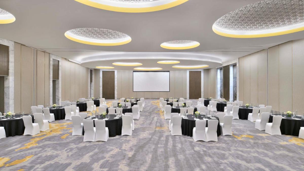 a banquet hall with white tables and white chairs at The Westin Resort & Spa Himalayas in Rishīkesh +155 photos