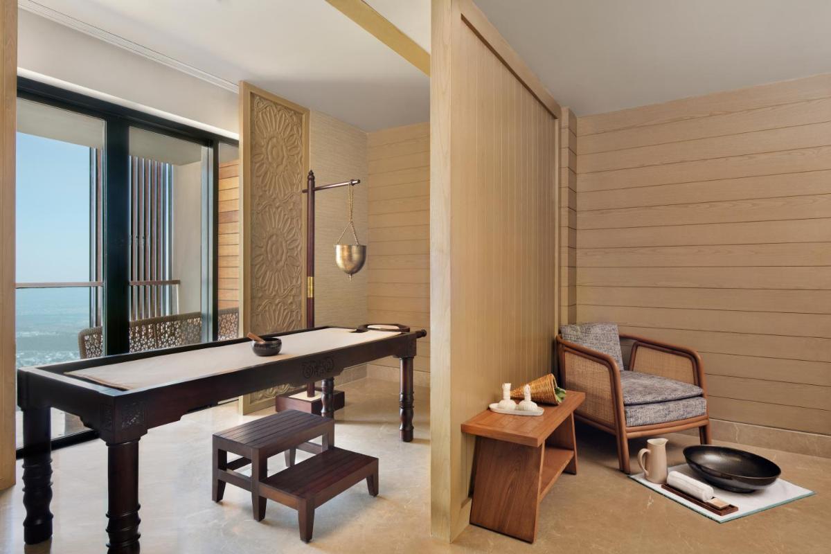 a room with a ping pong table and a chair at The Westin Resort & Spa Himalayas in Rishīkesh