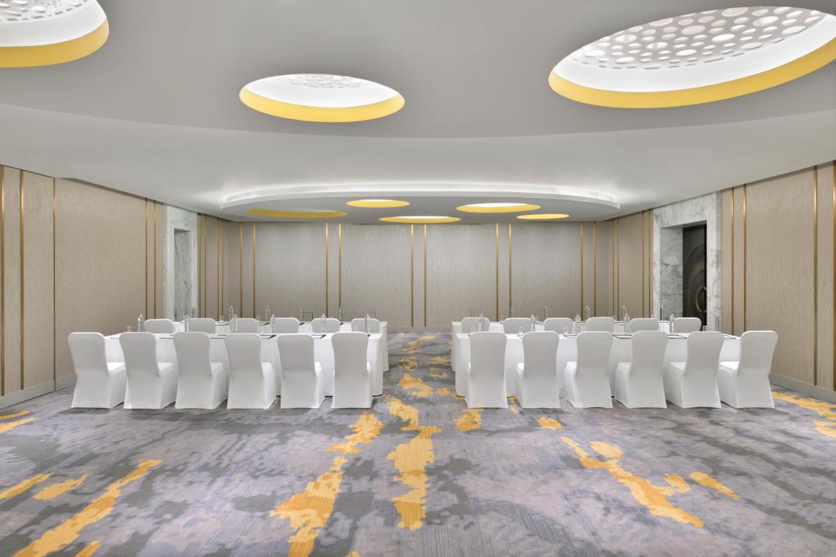 a conference room with white chairs and lights at The Westin Resort & Spa Himalayas in Rishīkesh