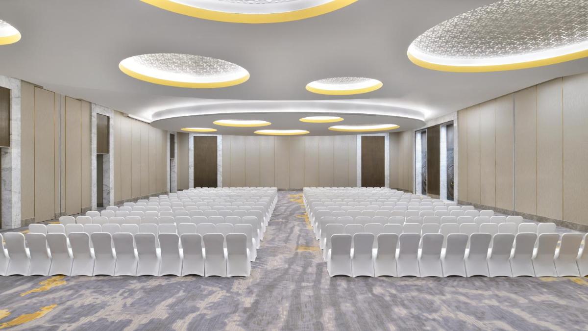 a room with rows of white chairs and lights at The Westin Resort & Spa Himalayas in Rishīkesh