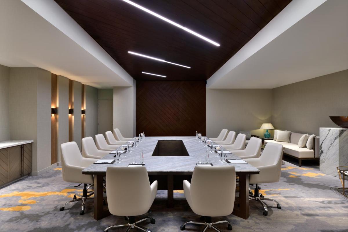 a large conference room with a long table and chairs at The Westin Resort & Spa Himalayas in Rishīkesh