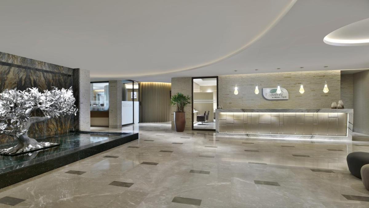 a lobby of a building with a large lobby at The Westin Resort & Spa Himalayas in Rishīkesh