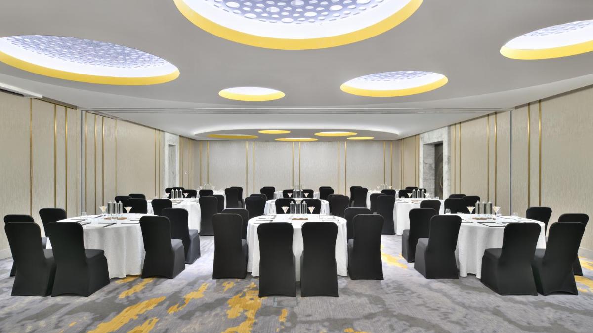 a conference room with tables and chairs in a room at The Westin Resort & Spa Himalayas in Rishīkesh